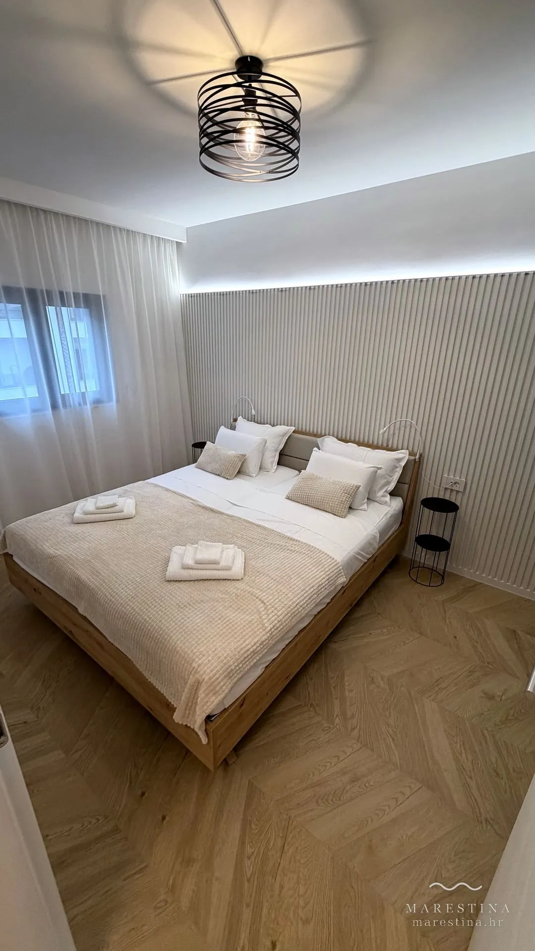 Second bedroom with double bed, wardrobe and workspace