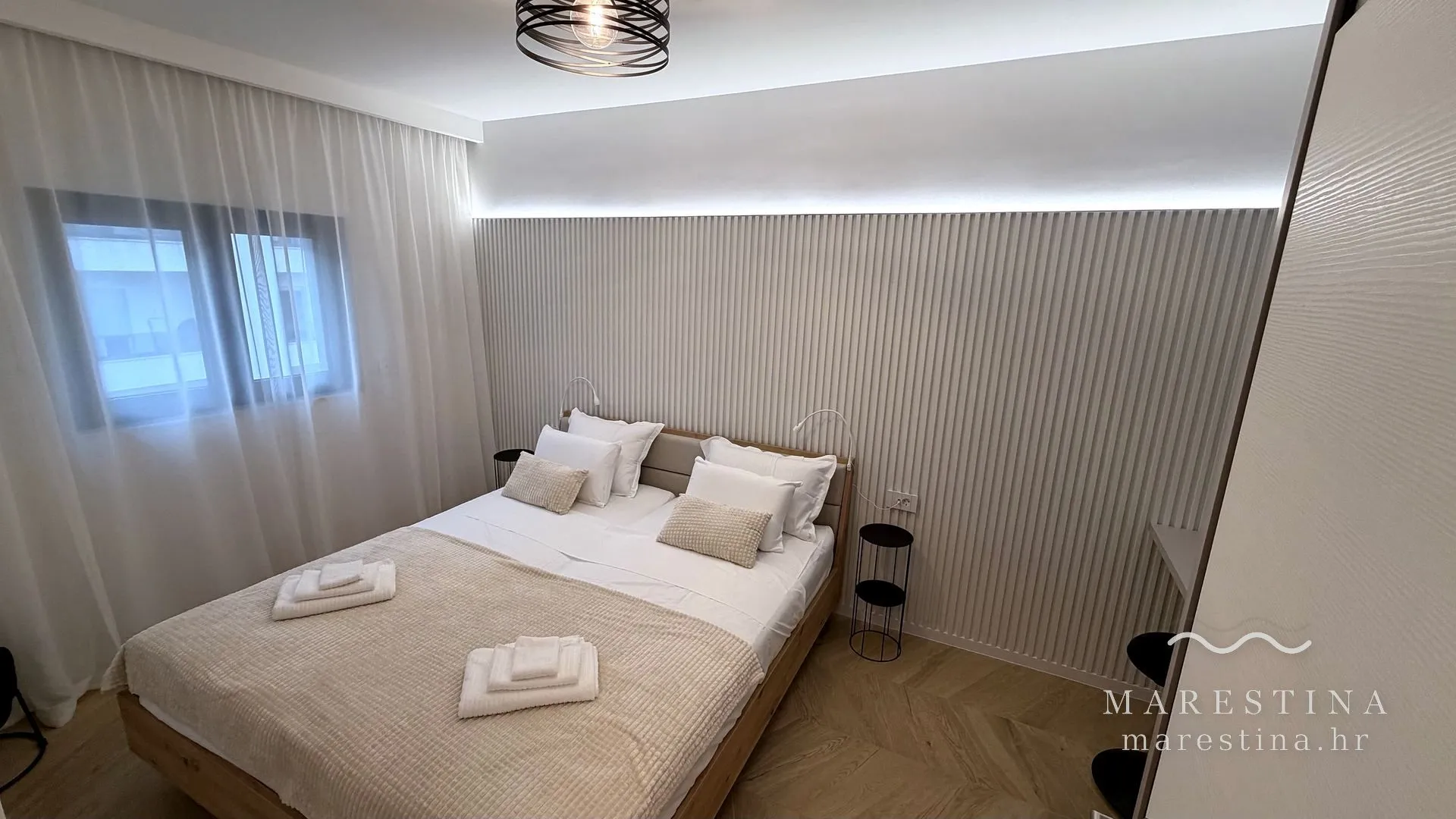 Second bedroom with double bed, wardrobe and workspace