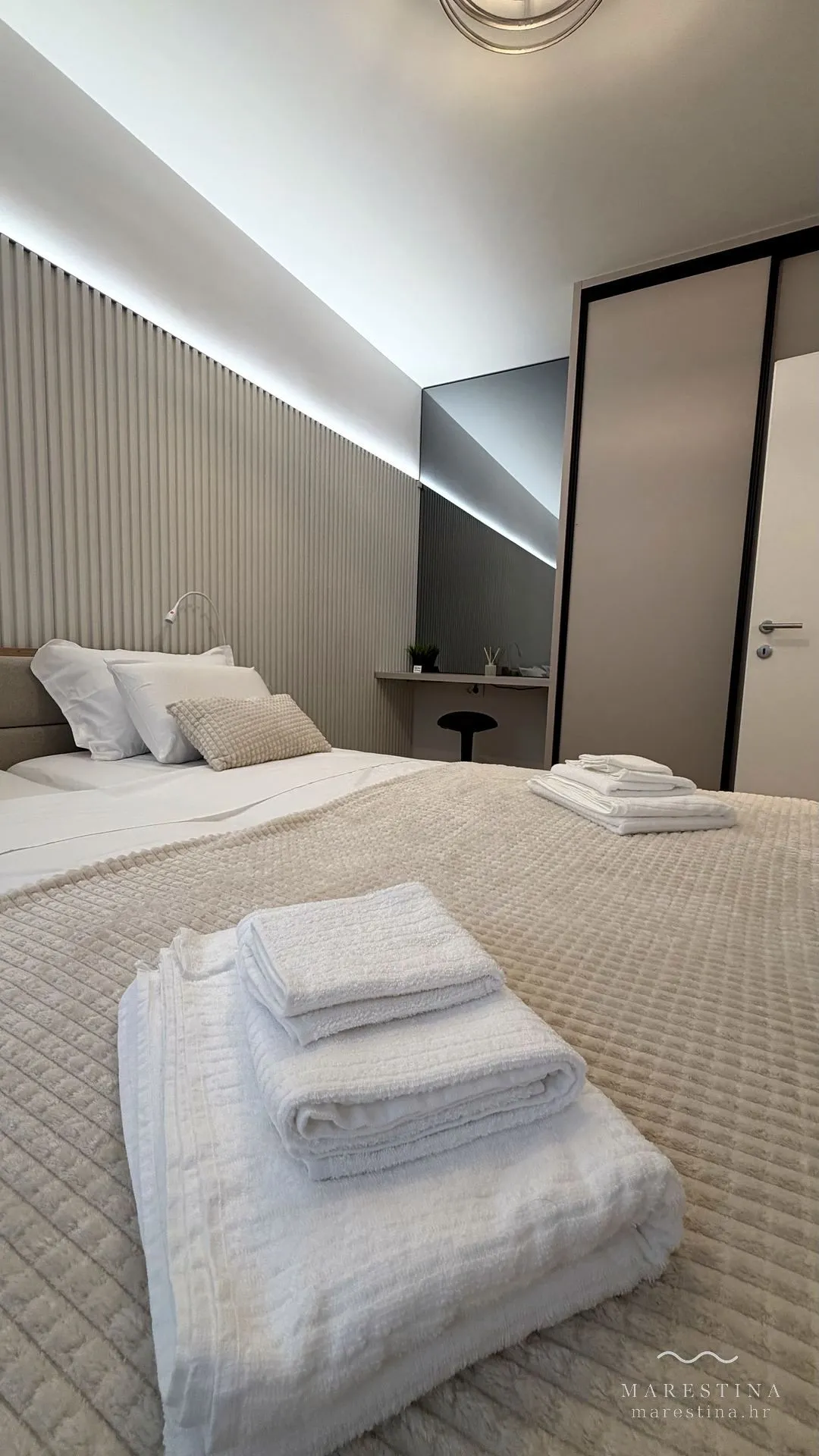 Second bedroom with double bed, wardrobe and workspace